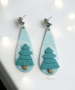 Minimalist Christmas Tree Earrings handmade from polymer clay, featuring teal trees on a marbled background with stainless steel hooks.
