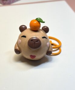 Alternative view of Capybara Chubblet with Orange – Polymer Clay Collectible Charm